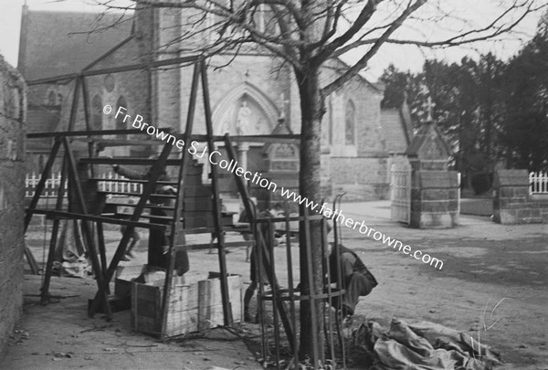 MARKET STALL BEING SET UP IN FRONT OF CHURCH